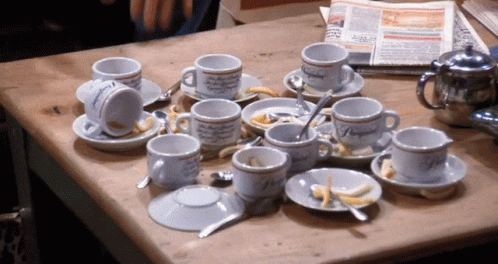 Friends tapping to coffee cups on coffee table health benefits